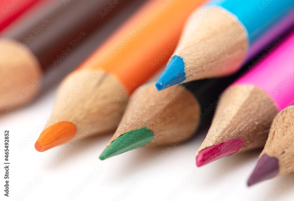 Multi-colored pencils on a white background. Multi-colored pencils on a white background.