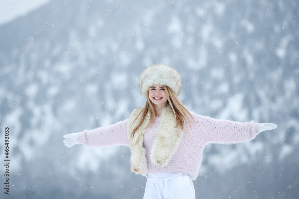Woman in the winter in nature. A beautiful girl walks in the cold season. High quality photo Woman in the winter in nature. A beautiful girl walks in the cold season. High quality photo