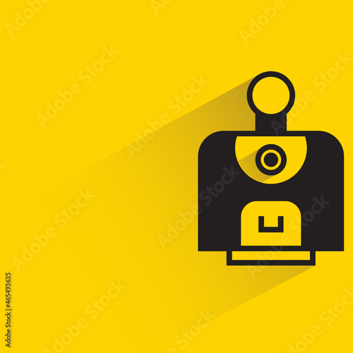 robot character with drop shadow on yellow background