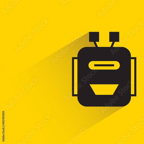 robot head with drop shadow on yellow background