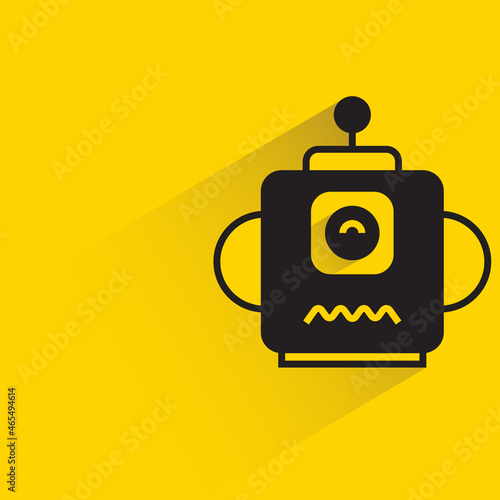 robot head with drop shadow on yellow background