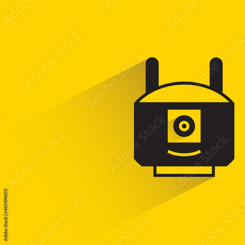 robot head with drop shadow on yellow background