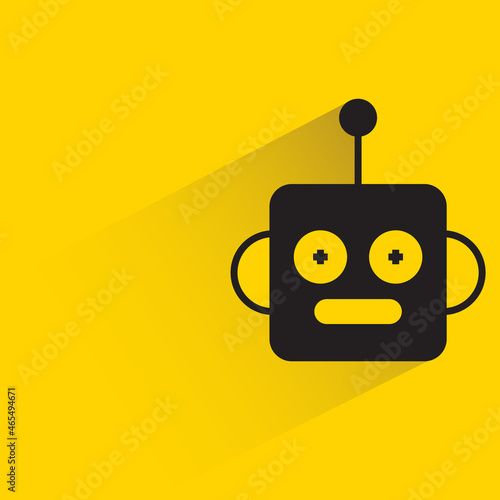 robot head with drop shadow on yellow background