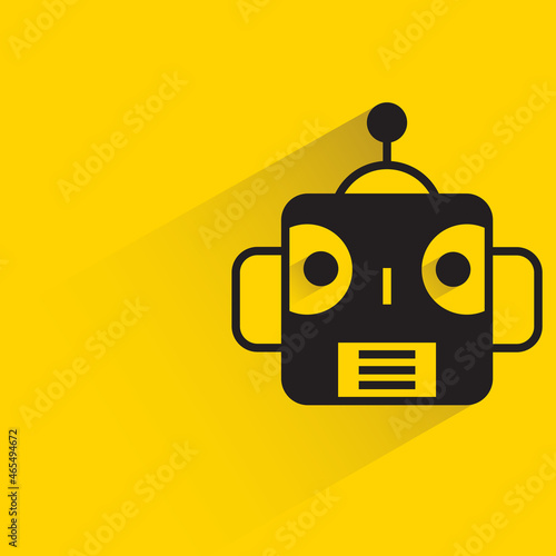 robot head with drop shadow on yellow background