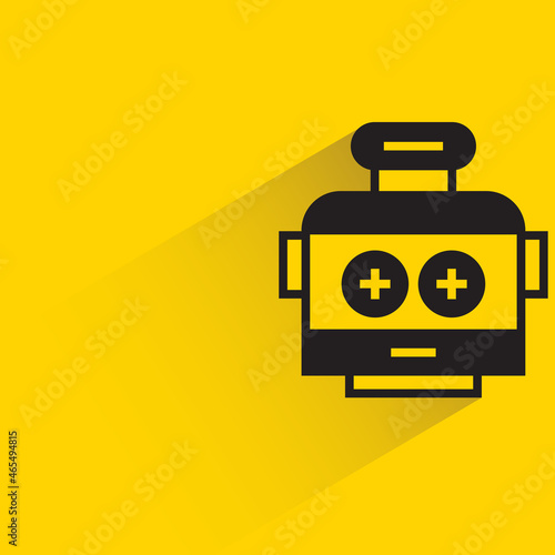 robot head with drop shadow on yellow background