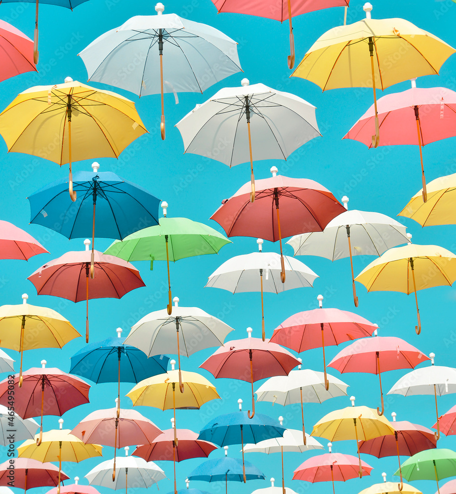 Colorful umbrellas in the sky.