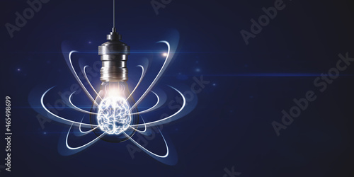 Abstract light bulb on dark backdrop with digital brain and atom outline and mock up place. Artificial intelligence, science and innovation concept. 3D Rendering.