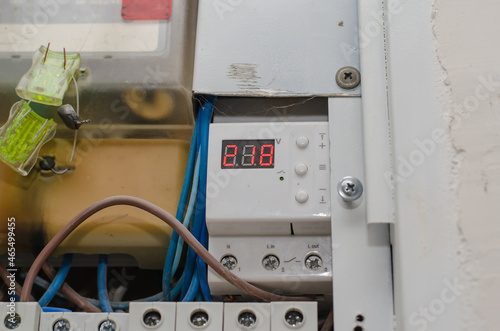 Voltage stabilizer. Digital display with red numbers. Electrics.