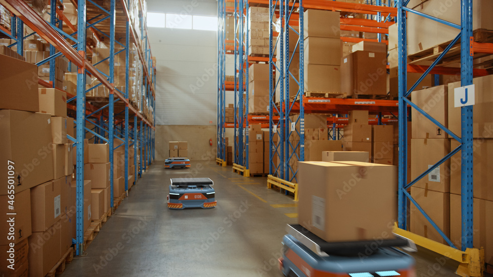 Future Technology 3D Concept: Automated Modern Retail Warehouse AGV Robots Transporting Cardboard Boxes in Distribution Logistics Center. Automated Guided Vehicles Delivering Goods, Products, Packages