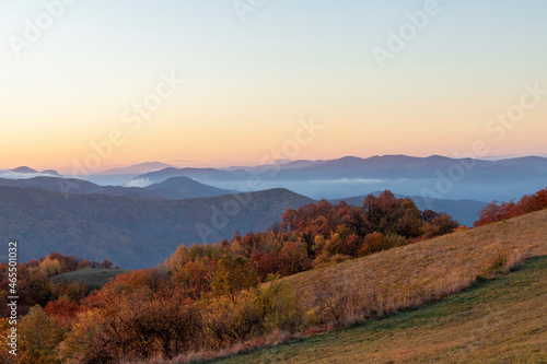 Fototapeta Naklejka Na Ścianę i Meble -  A sunrise over the mountains and forests