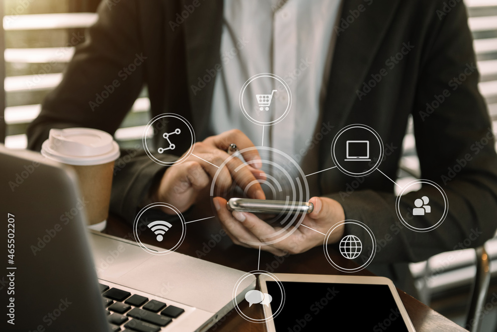 Businessman use keyboard laptop printing for mobile payments, online shopping, Omni channels, sitting at virtual chairs, screen icons, on-screen graphics.