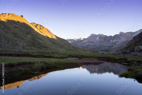 river on a mountain landscape at sunset in the pyrenees © urdialex