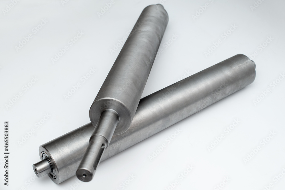 Steel metal pipe-shaft made on a lathe for the factory conveyor industry. Steel metal pipe-shaft made on a lathe for the factory conveyor industry.