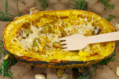 Not only for Halloweem, Deliciously prepared spaghetti squash with parmesan cheese, pistachios, garlic and rosemary photo