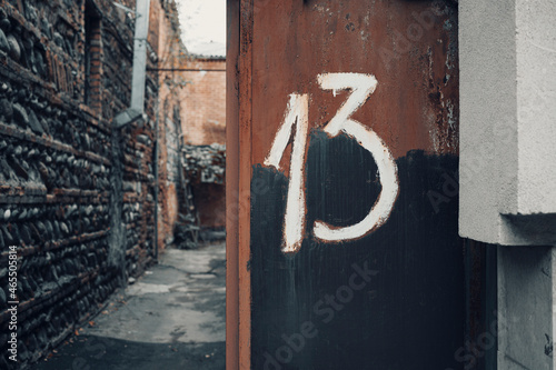 Door with number 13 . Bakers dozen concept 