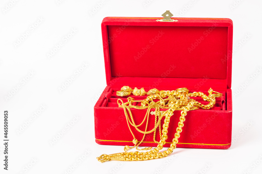 Group of gold necklace and gold ring of accessories in red box. Group of gold necklace and gold ring of accessories in red box.