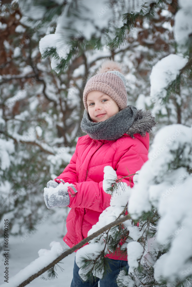 Child in winter. A little girl, playing in the winter outside. Child in winter. A little girl, playing in the winter outside.