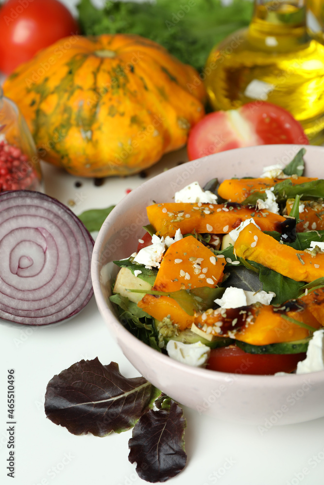 Concept of cooking pumpkin salad on white background Concept of cooking pumpkin salad on white background