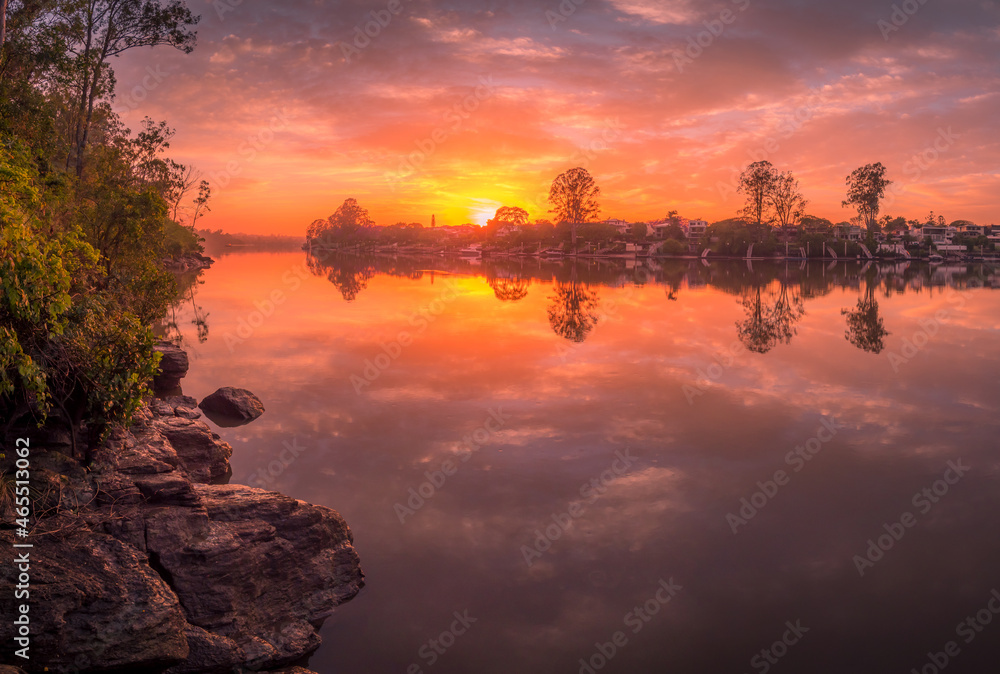 Beautiful Riverside Sunrise with Cloud Reflections