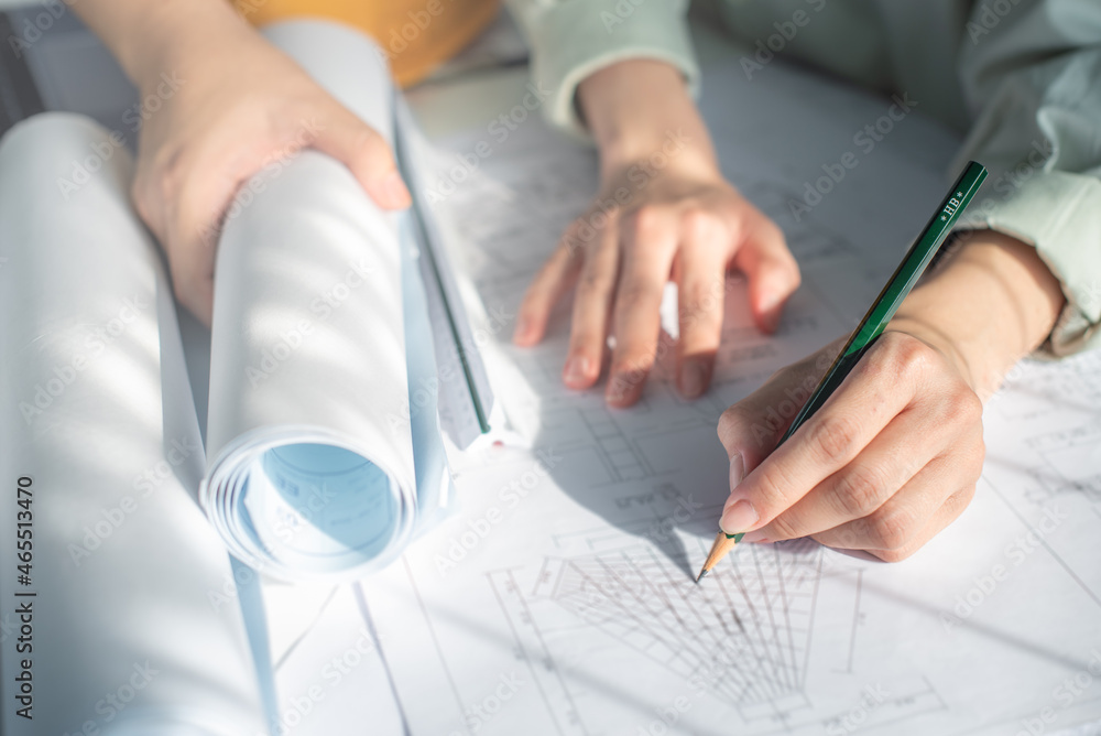 Architect working on blueprint. Architects workplace - architectural ...