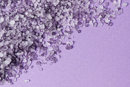 фотографія Top view of violet bath salt crystals background with copy space.
