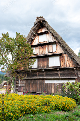 Old traditional Japanese house with thatched roof photo