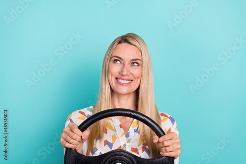 Photo of lovely young blond lady drive look empty space wear printed blouse isolated on teal color background