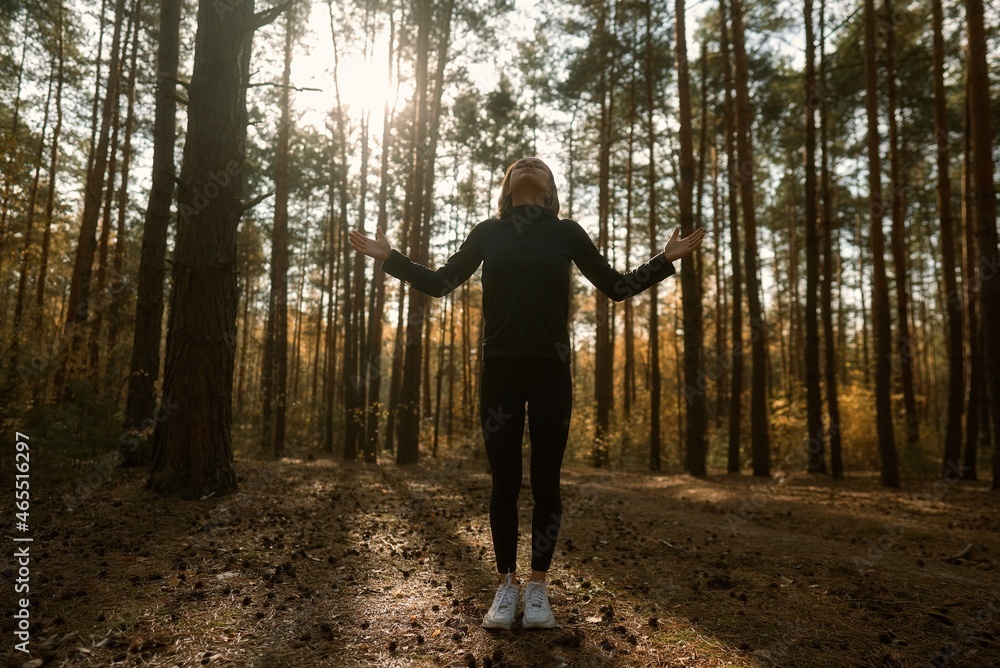 A young woman make yoga position at sunrise. in the autumn forest . High quality photo A young woman make yoga position at sunrise. in the autumn forest . High quality photo