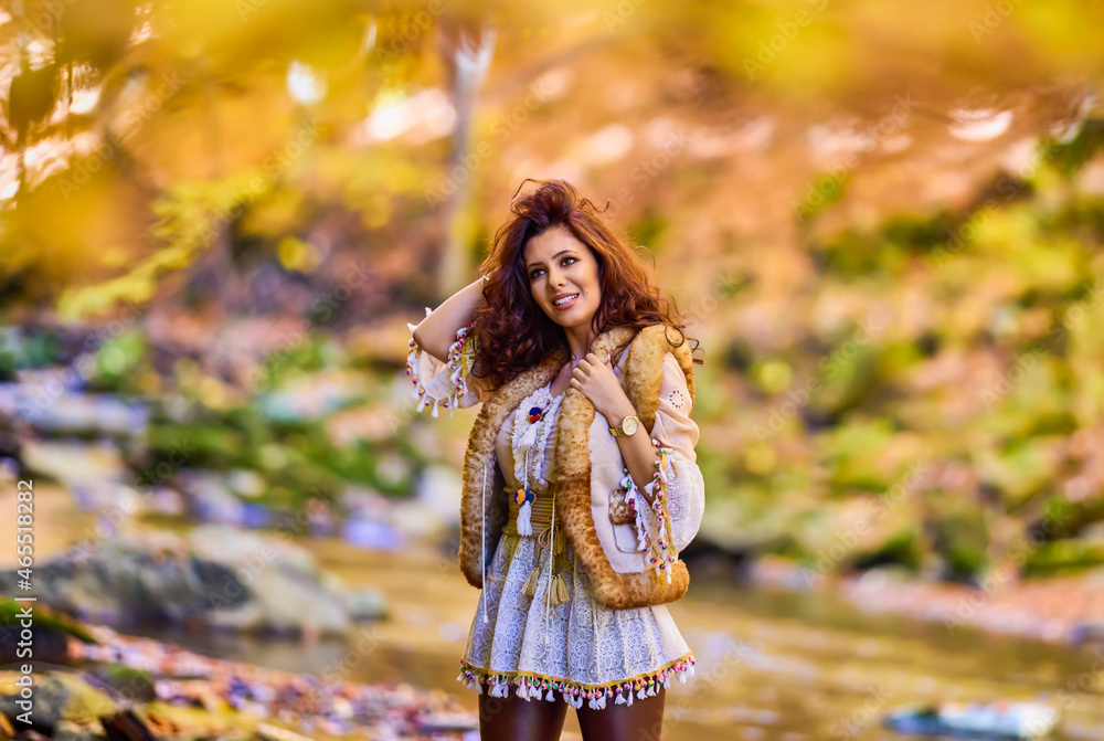 Autumn portrait with a beautiful woman in different positions near a mountain river. Autumn portrait with a beautiful woman in different positions near a mountain river.