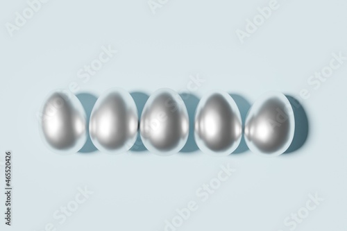 3d render of silver easter eggs on a sky blue background