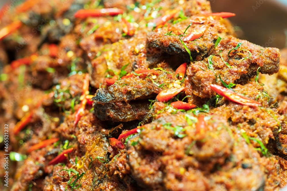 Closeup of Stir Fried Crispy Catfish with Curry background thai street food market