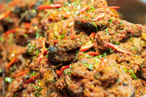 Closeup of Stir Fried Crispy Catfish with Curry background thai street food market