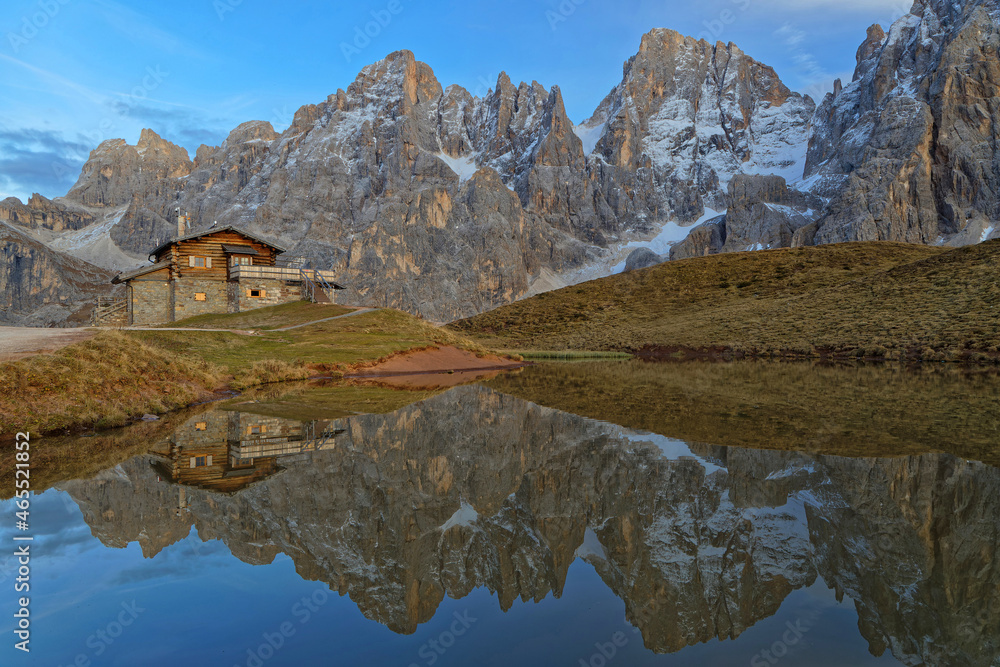 The Pale di San Martino Group reflecting on a lake during sunset, in Dolomites , Trentino Alto Adige, Italy