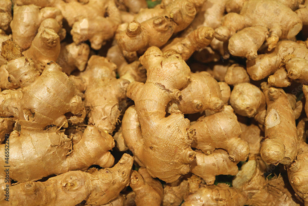 Heap of fresh ginger rhizomes for sale on the market Heap of fresh ginger rhizomes for sale on the market