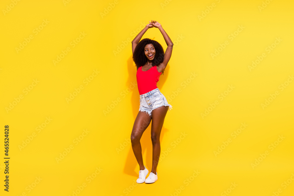 Full length body size view of pretty cheerful girl dancing having fun clubbing event isolated over bright yellow color background