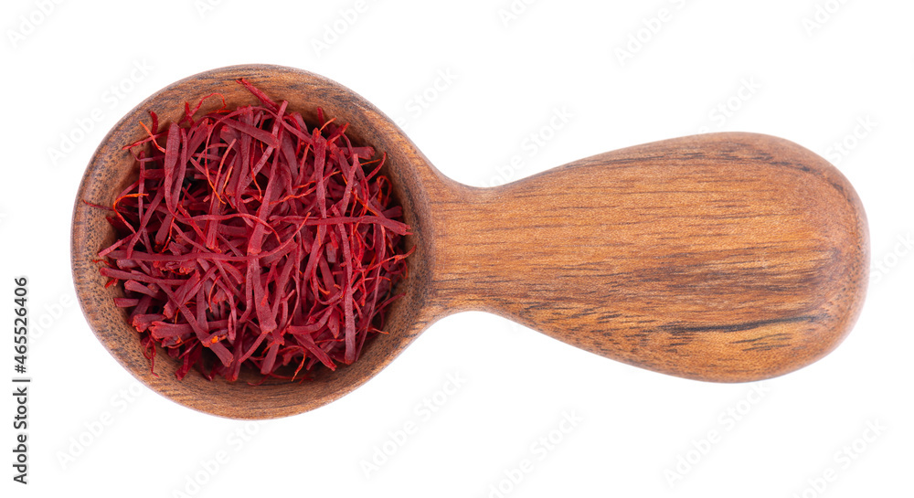 Saffron in wooden spoon, isolated on white background. Natural dry saffron threads, from crocus flowers. Clipping path. Top view. Saffron in wooden spoon, isolated on white background. Natural dry saffron threads, from crocus flowers. Clipping path. Top view.
