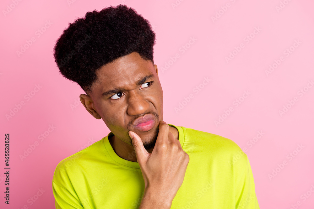 Portrait of attractive moody mad angry guy overthinking grimacing copy space isolated over pink pastel color background Portrait of attractive moody mad angry guy overthinking grimacing copy space isolated over pink pastel color background