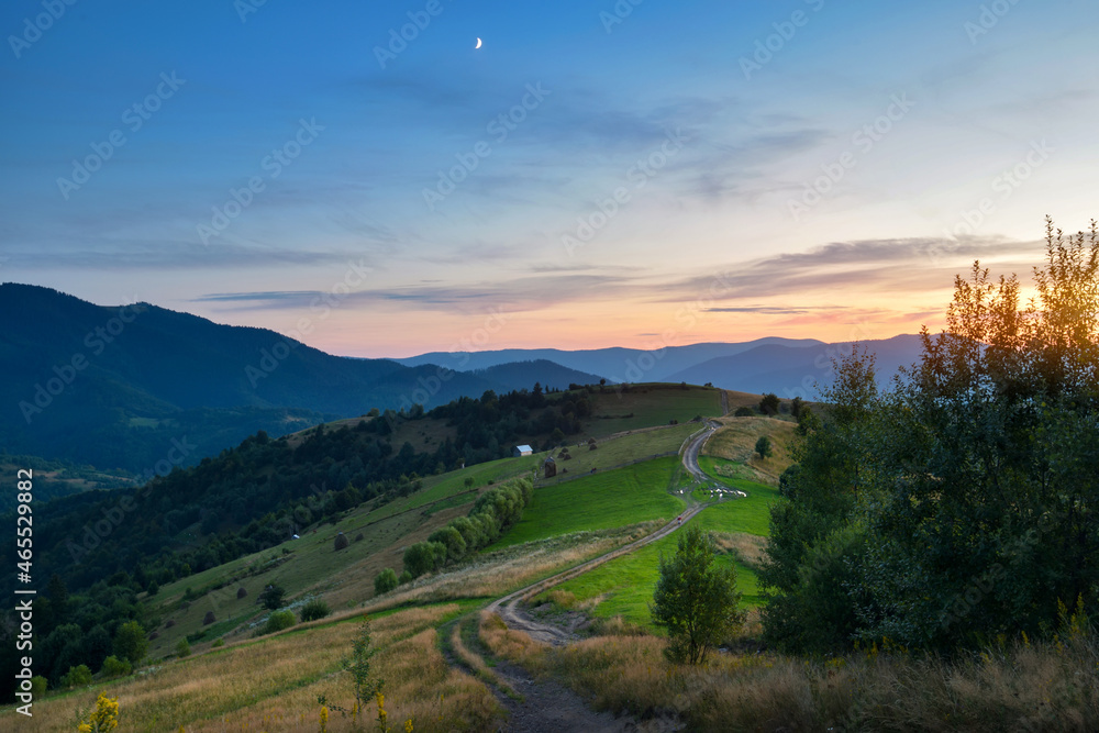 Beautiful landscape in the mountains. Sunset. Evening light lay on a mountain hills.