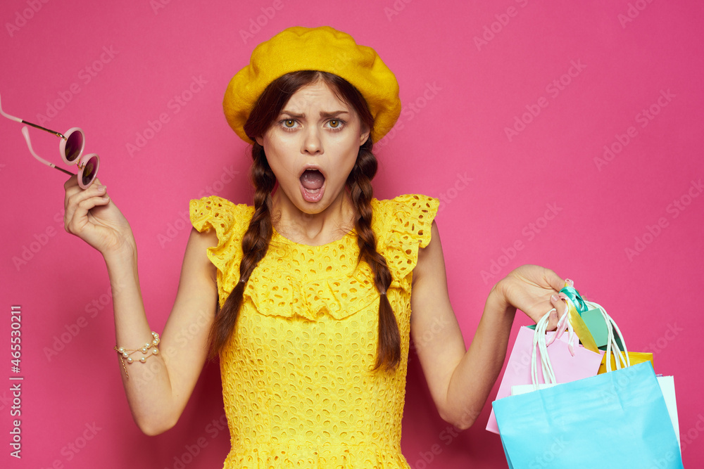 smiling woman with multicolored bags posing isolated background smiling woman with multicolored bags posing isolated background