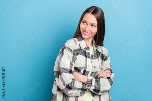 Profile side photo of young attractive lovely girl happy positive smile folded hands look empty space isolated over blue color background