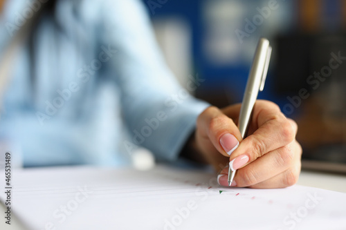 Woman use silver pen for writing Fototapete