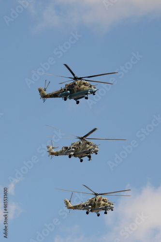 Wallpaper Mural A group of Mi-35M and Mi-24 attack combat helicopters in the sky over Moscow's Red Square during the dress rehearsal of the Victory Air Parade Torontodigital.ca