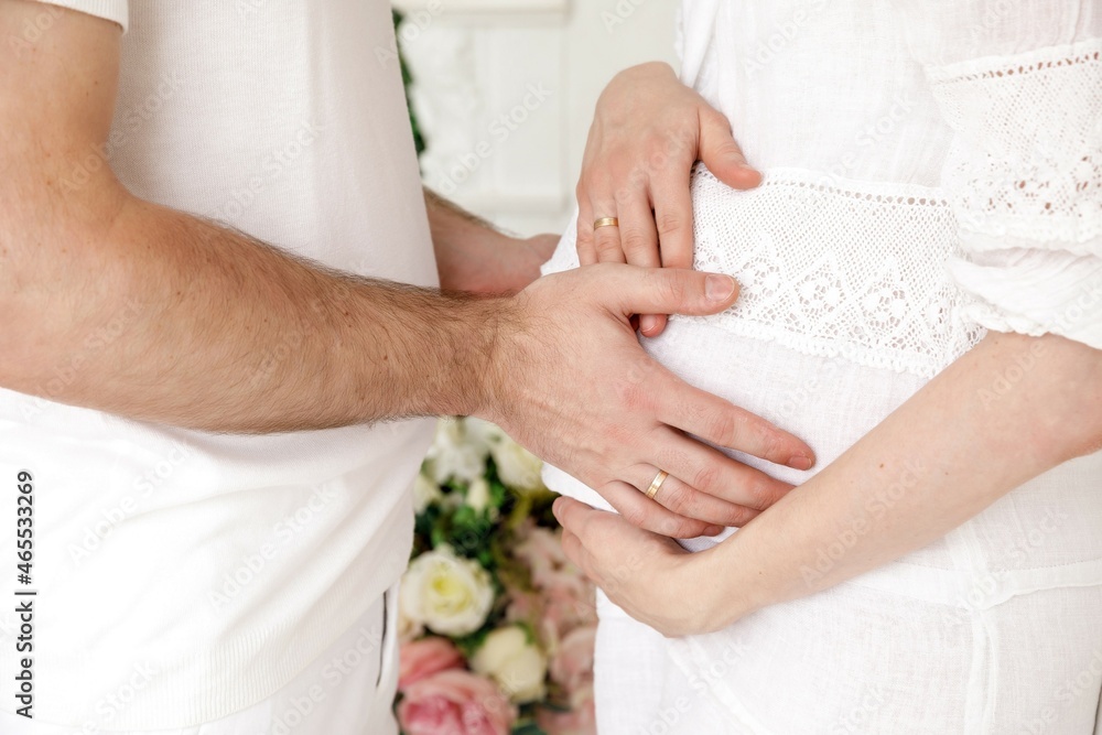 Husband gently touching belly of his pregant wife Husband gently touching belly of his pregant wife