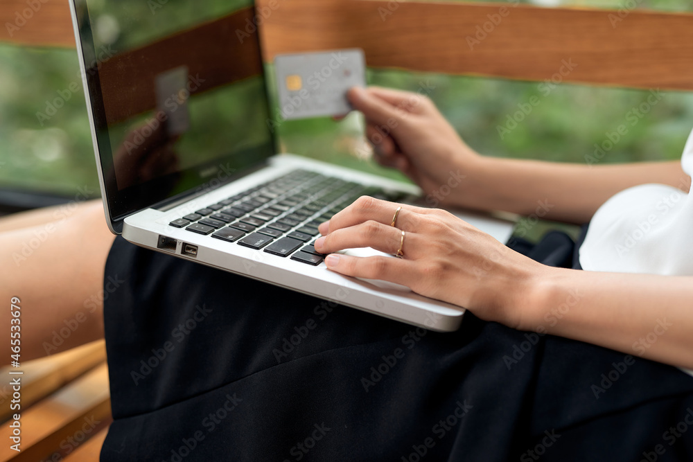 Asian woman using laptop and credit card shopping ecommerce Asian woman using laptop and credit card shopping ecommerce