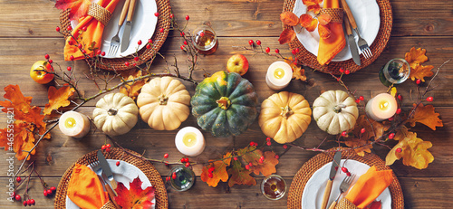 Canvas Print Autumnal decorated table for celebrating Thanksgiving or other family celebratio