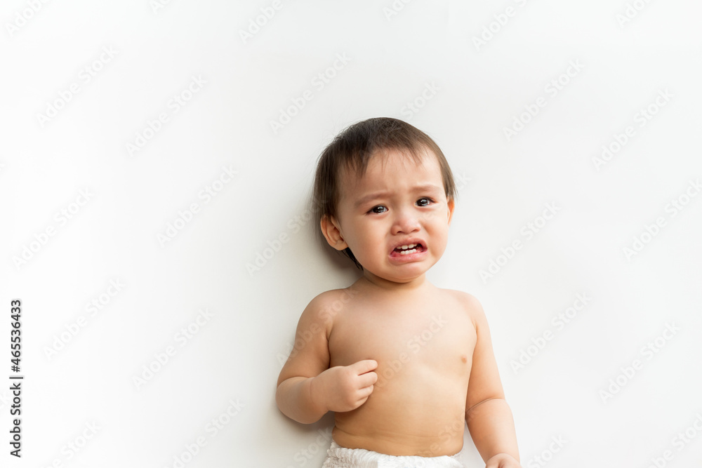 Portrait of baby boy standing crying on white isolated background. Cute little son child is crying. Support protection of empathy and consoling concept, Family relationships concept. Portrait of baby boy standing crying on white isolated background. Cute little son child is crying. Support protection of empathy and consoling concept, Family relationships concept.