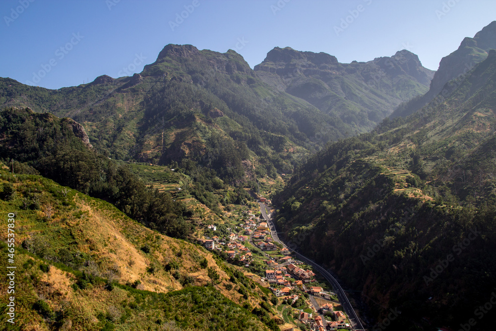 Madeira, Portugal, beautiful view of valley and mountains in the heart of Madeira, road goes through the mountains and village in the valley Madeira, Portugal, beautiful view of valley and mountains in the heart of Madeira, road goes through the mountains and village in the valley