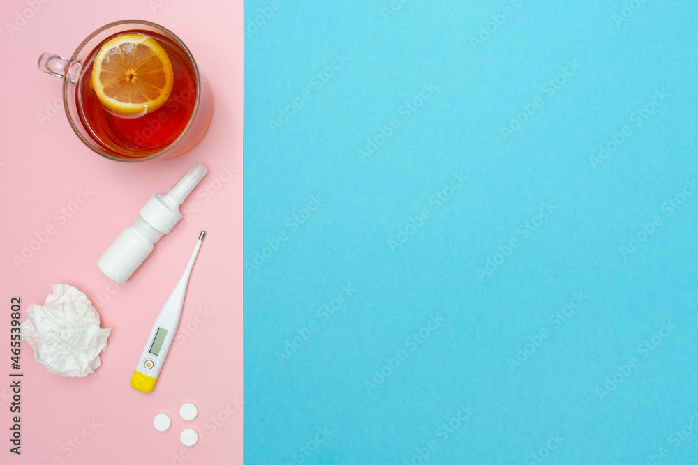 Catch a cold. Flu season. Disease. Flat lay. Medical mask, pills, nasal spray, used wipes, thermometer, and lemon tea. Place for your text. Copy space. Mockup. Seasonal cold concept. Health care. Catch a cold. Flu season. Disease. Flat lay. Medical mask, pills, nasal spray, used wipes, thermometer, and lemon tea. Place for your text. Copy space. Mockup. Seasonal cold concept. Health care.