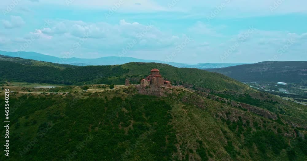 Jvari monastery on the background of mountains and blue sky. The main attraction of Mtskheta Jvari monastery on the background of mountains and blue sky. The main attraction of Mtskheta