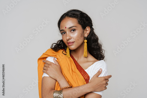 Young south asian woman with bindi posing in sari photo